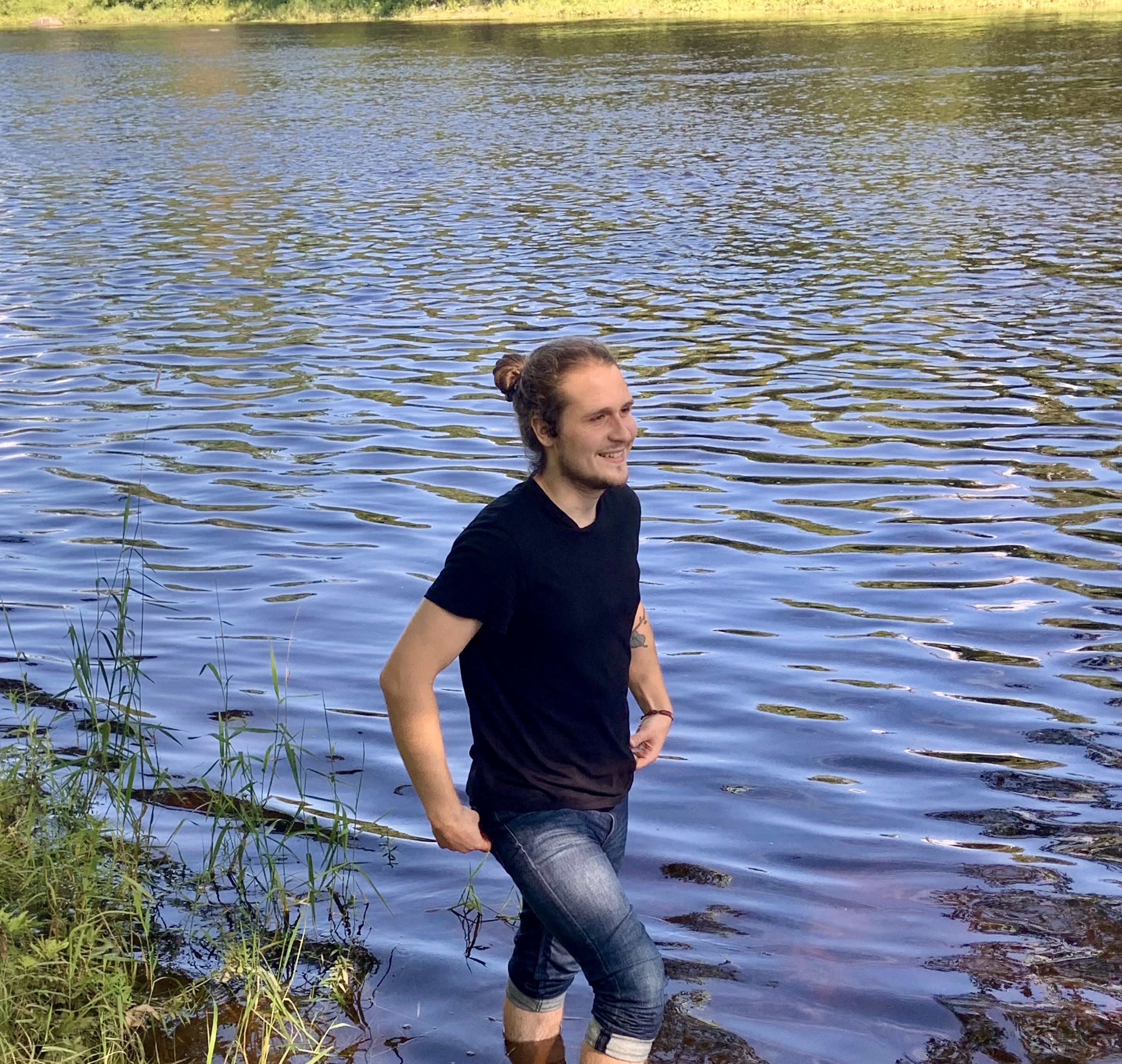 man walking in lake