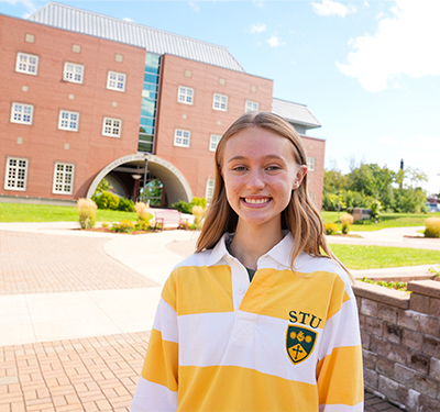 Photo of STU Alumna Emily Green on campus in summer
