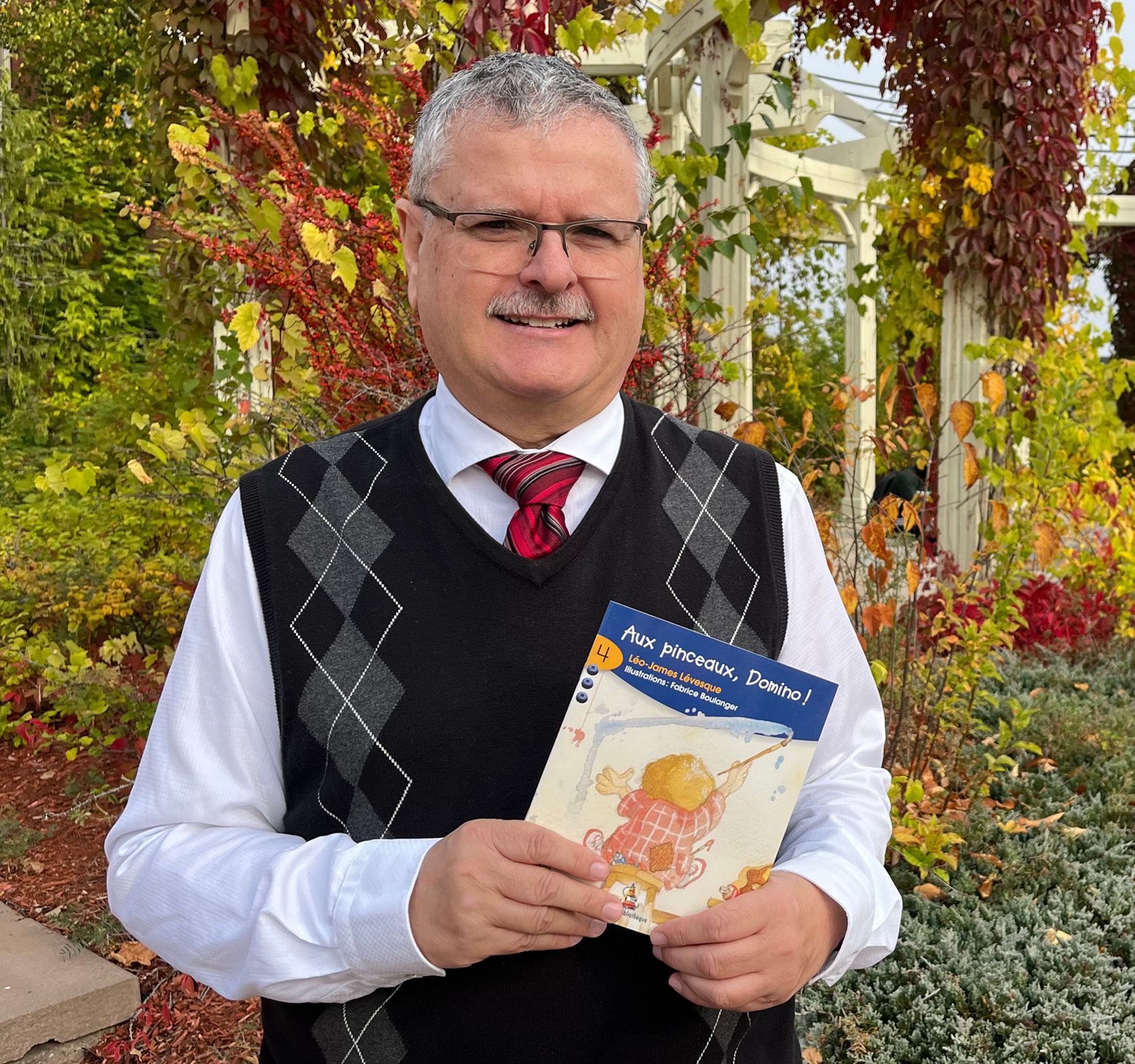 Leo James Levesque holding book