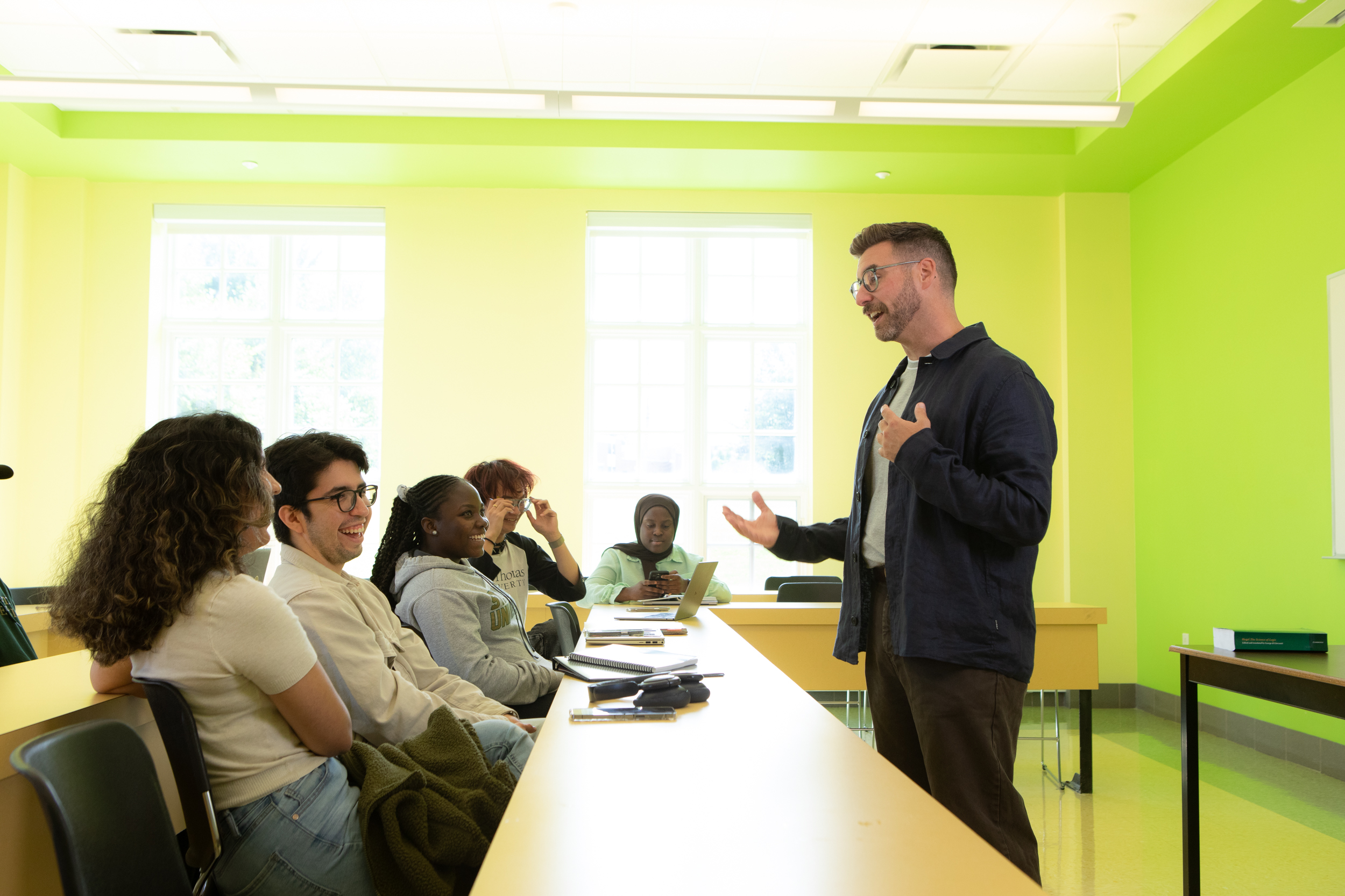 Dr. Matt Dinan speaking to a class