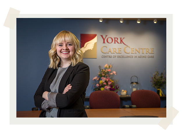Student standing in front of York Care Centre sign