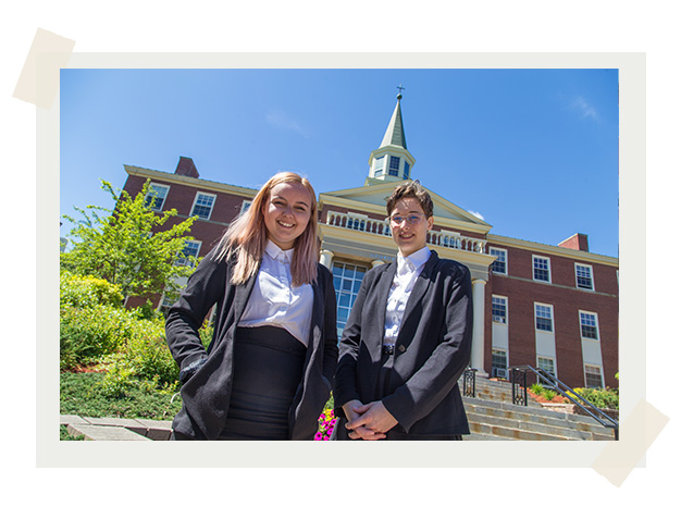 STUdents Navy Vezina and Abbie LeBlanc, winners of the Nelson Mandela World Moot Court Competition, stand in front of George Martin Hall