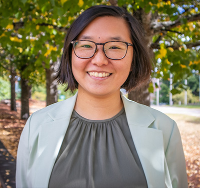 Dr. Doris Chow standing outside on campus