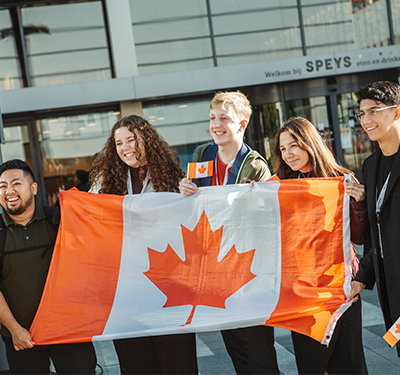 Students holding Canadian Flag at the Enactus World Cup